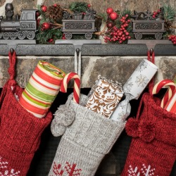 Stockings hung on a fireplace mantle.