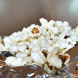 Popped corn in aluminum foil.