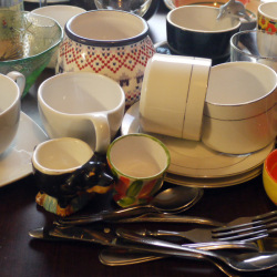 A collection of mismatched dishes from the thrift store.