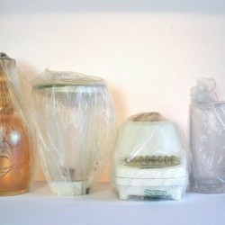 Produce bags covering a blender and other small kitchen items.