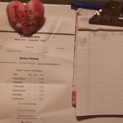 A clipboard with reminders written on it.