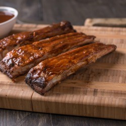 Pork ribs on a cutting board.