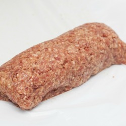A meatloaf made with ground meat, vegetables and egg.