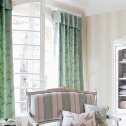 Beige walls and green curtains.