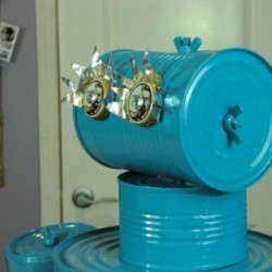 A blue robot made out of aluminum (tin) cans.