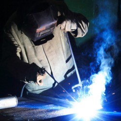 A person welding.