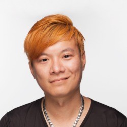 A young man with orange hair.