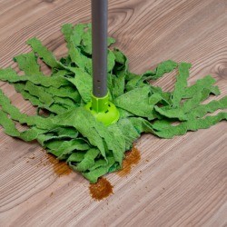 A spill on a laminate floor, being cleaned up with a mop.