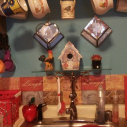 DIY Backsplash - finished area with decorations on wall above backsplash