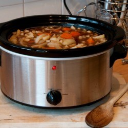 A pot of soup in a slow cooker.