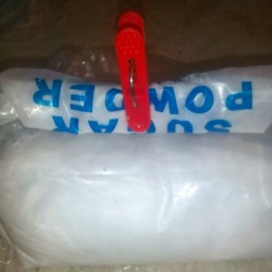 A clothespin on a folded plastic bag.