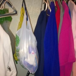 A bag of socks hanging in the closet.