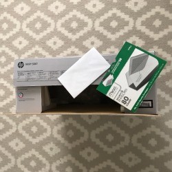 A product box with receipt and manual, saved in case of a return.