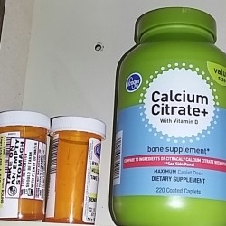 Prescription bottles in a medicine cabinet.