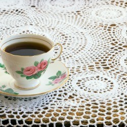 Crochet Tablecloth with a cup of tea on it.