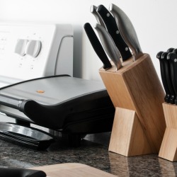 Table top grill on a kitchen counter.