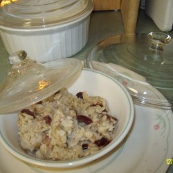 An old casserole lid covering a plate of leftovers.