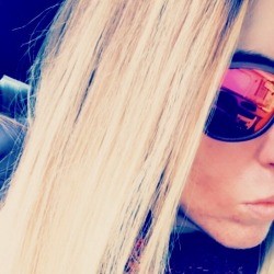 Blonde hair after using ketchup to remove green tones.
