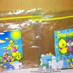 Two children's puzzles in plastic bags.