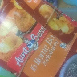A box of frozen food held closed with an elastic band.