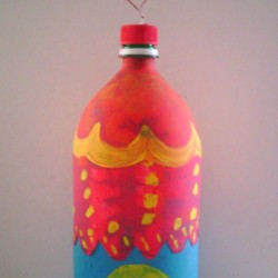 Soda Bottle Bird Feeder - finished bottle with more decorative painting and ready to hang