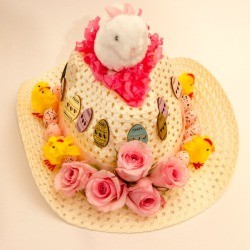 A straw cowboy hat with Easter decorations.