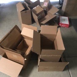 A pile of different sizes of cardboard boxes.