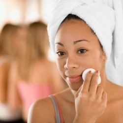 Girl applying Witch Hazel Toner to her face