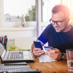 Man Reviewing his Credit Card Rewards