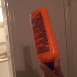 A bottle being turned upside down.
