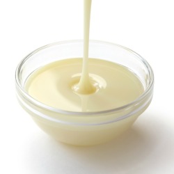 A small bowl of evaporated milk.