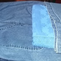 Fold Clothes Together for Traveling - beginning to fold short up over shirt