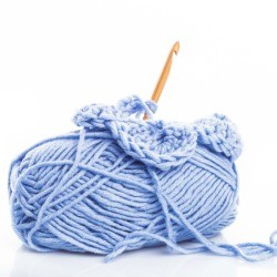 A skien on yarn and a crochet hook.