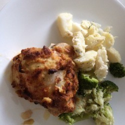 Hummus-Crusted Chickenon dinner plate with broccoli and potatoes 