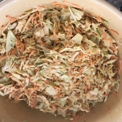 mixing sauce in Sweet and Spicy Coleslaw