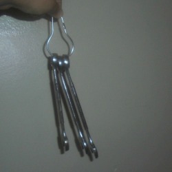Tools hanging on a shower hook.