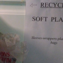 Signs for where to recycle plastics.