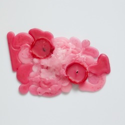 Spilled red candle wax.