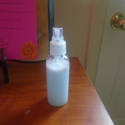 A bottle of conditioning spray for dogs.