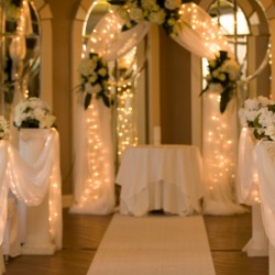 Tulle and lights decorating a wedding.