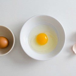 Egg cracked in a bowl.