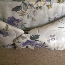 The bedding tied back and clipped with a binder clip, so it is no longer a tripping hazard.