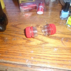 Two bottle caps to be screwed together for a ring stored inside.