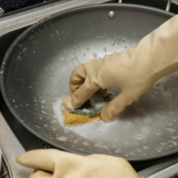 Cleaning a pan.