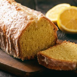 Homemade lemon loaf on a cutting board.