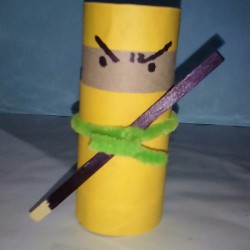 A completed ninja made from a recycled toilet paper roll.