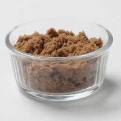A bowl of soft brown sugar.