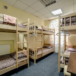 A bedroom with several bunk beds.
