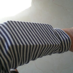 Storing a cellphone in a sleeve with a rubber band.