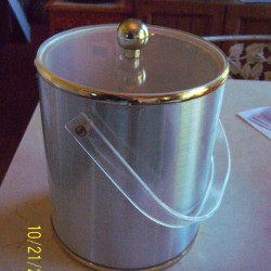 An ice bucket with a lid, for food scraps.